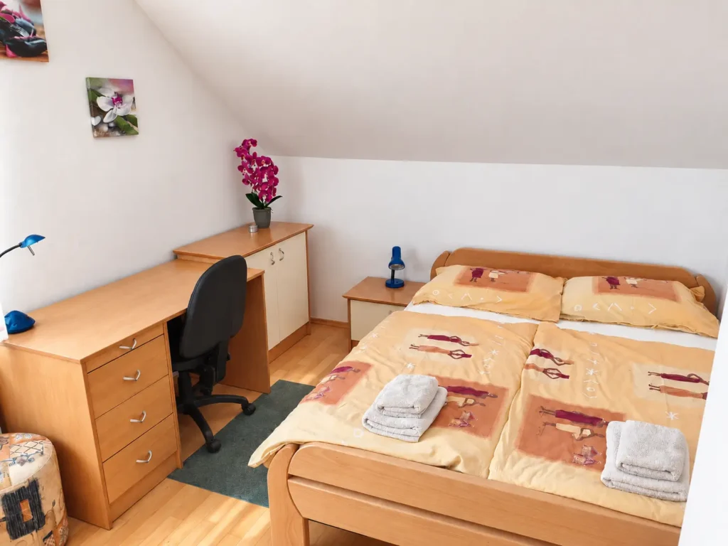 Orchid Room with a comfortable double bed and workspace