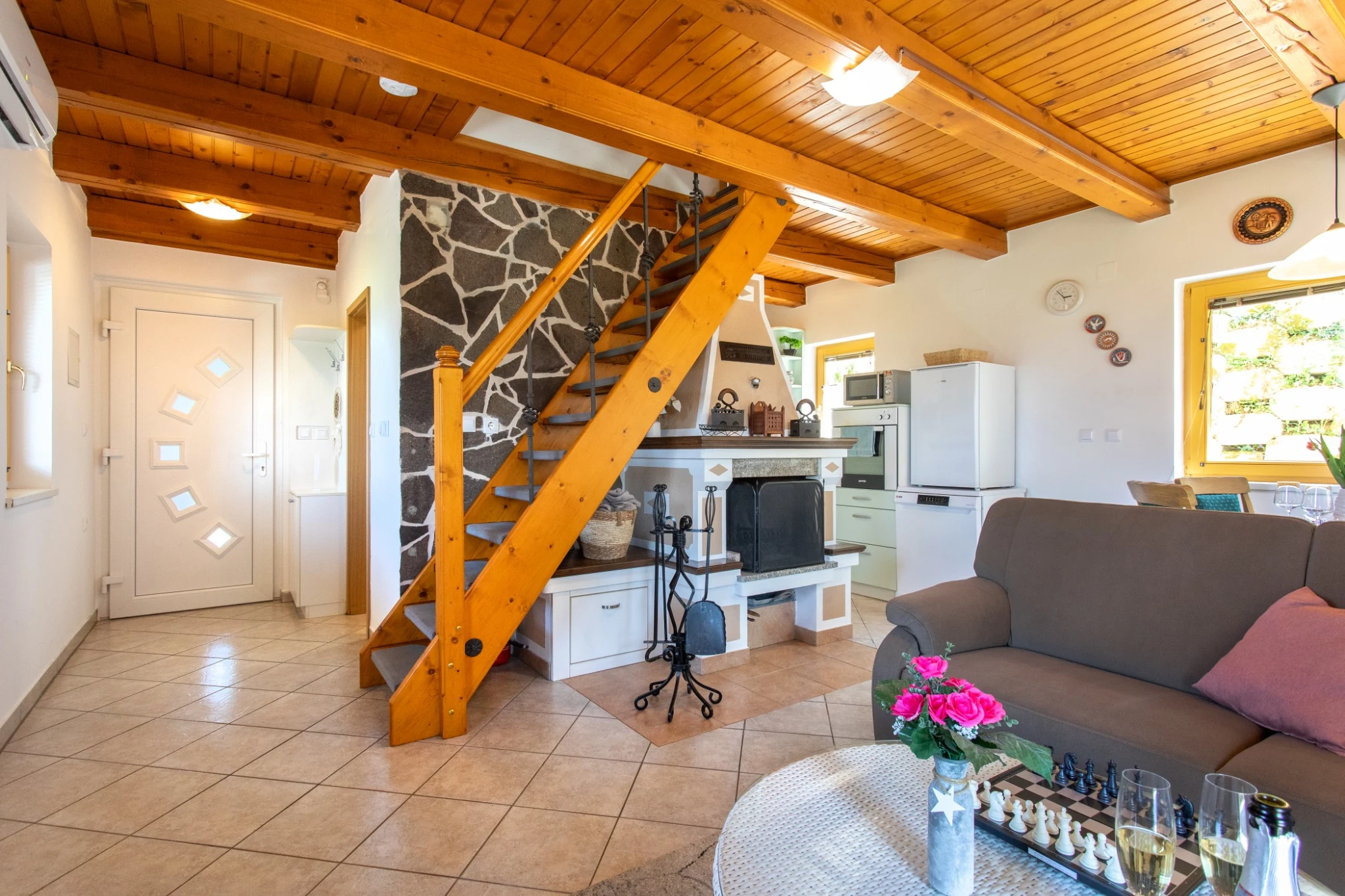 Butterfly Place 9 Living room with wooden staircase and fireplace
