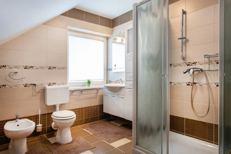 Shared bathroom with shower, toilet and bidet