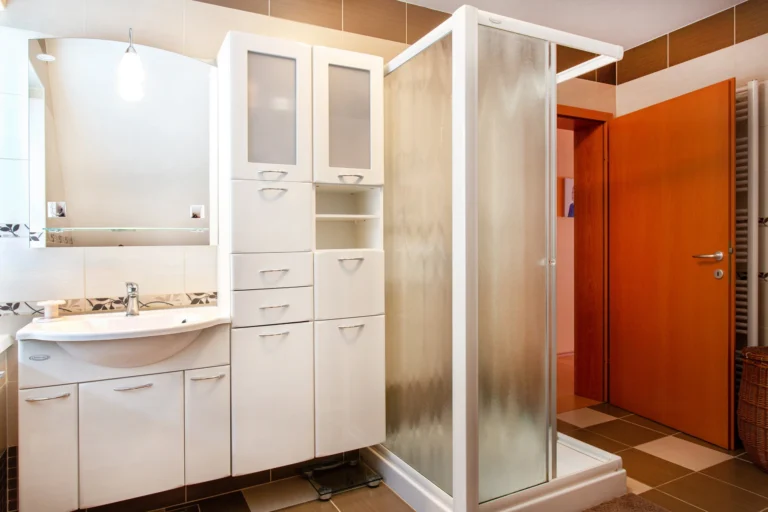 Shared bathroom washbasin and shower